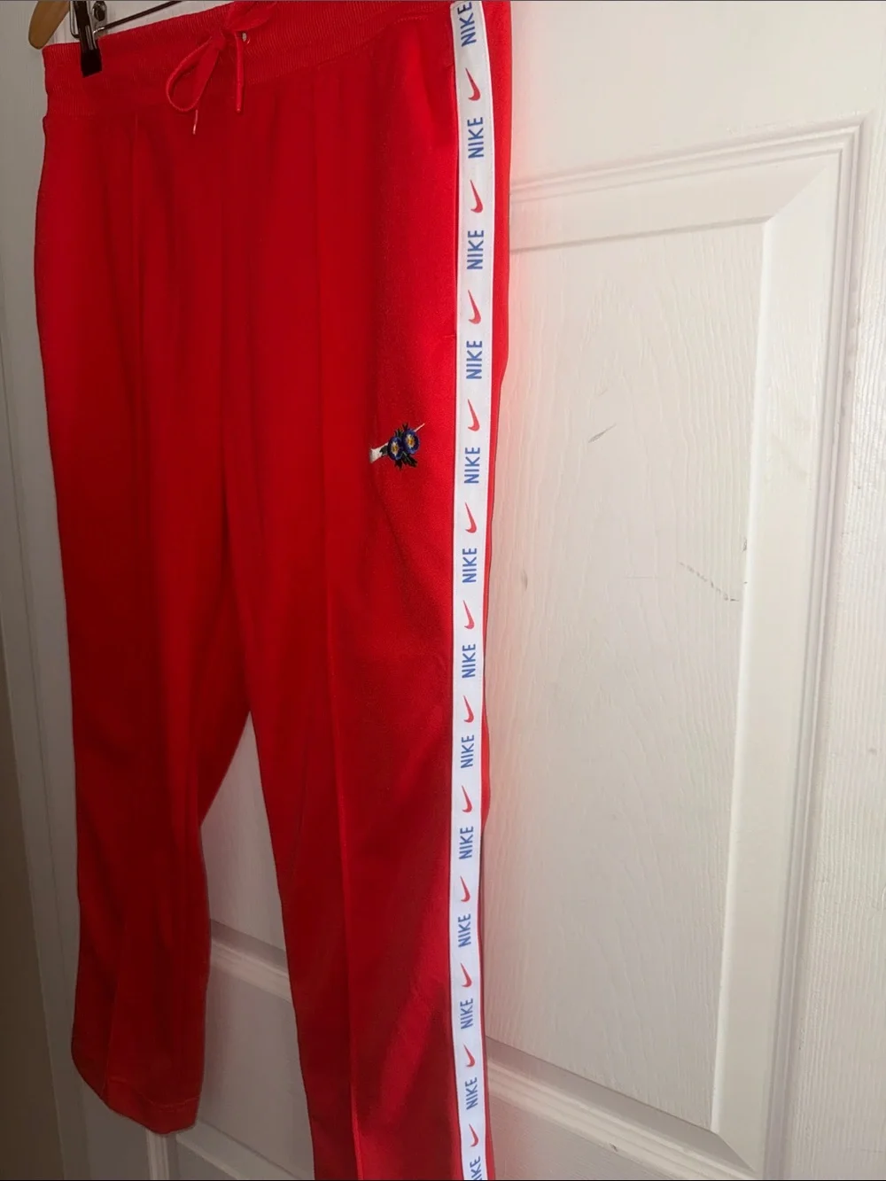 Nike Red Track Pants with White Logo Tape